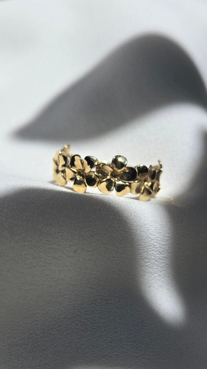 K10YG PLUMERIA HALF ETERNITY RING